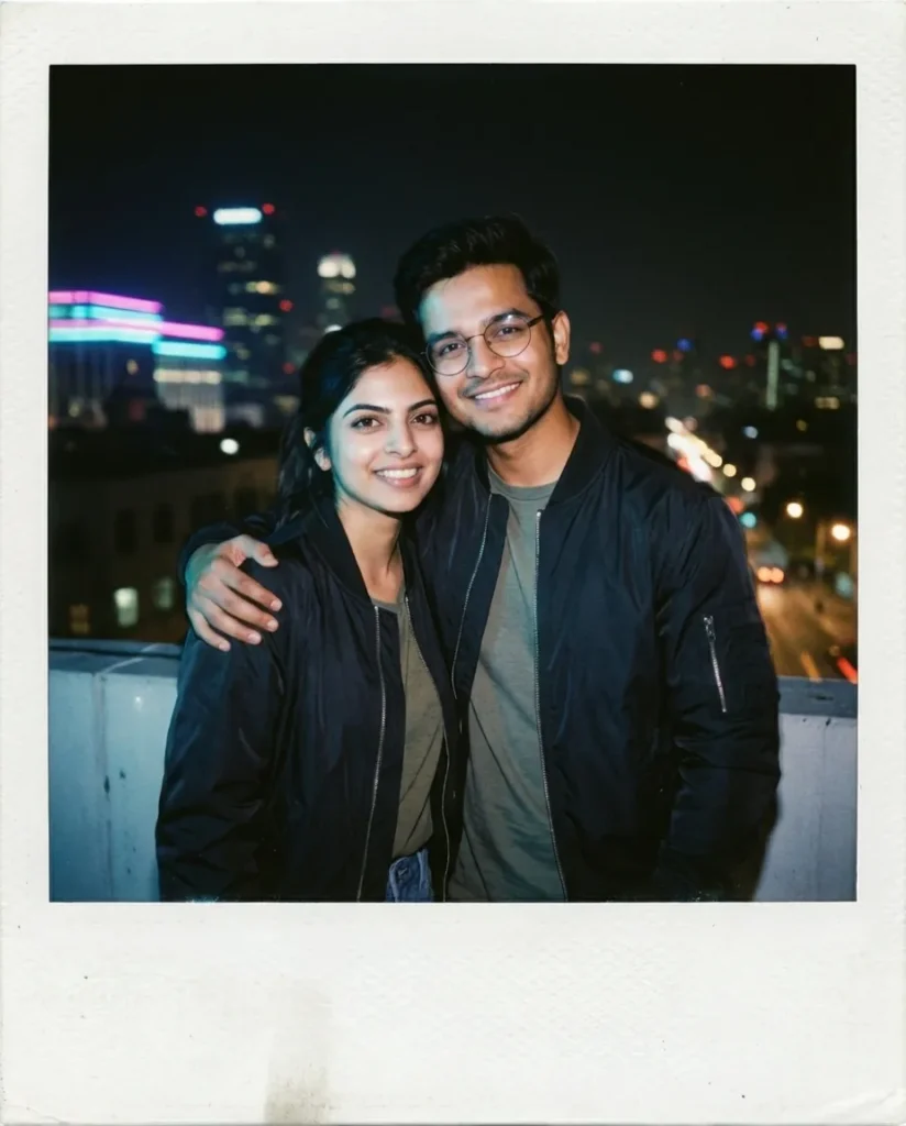 A flash-illuminated Polaroid photo of a couple in bomber jackets standing together on a rooftop at night, backed by a blurred city skyline with neon lights.