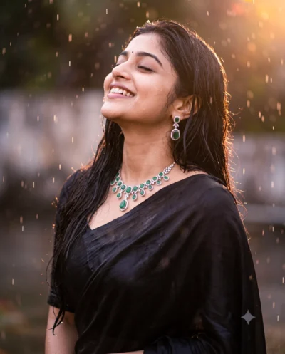 AI-generated image: Cinematic Black Saree Prompt: Woman in Golden Rain